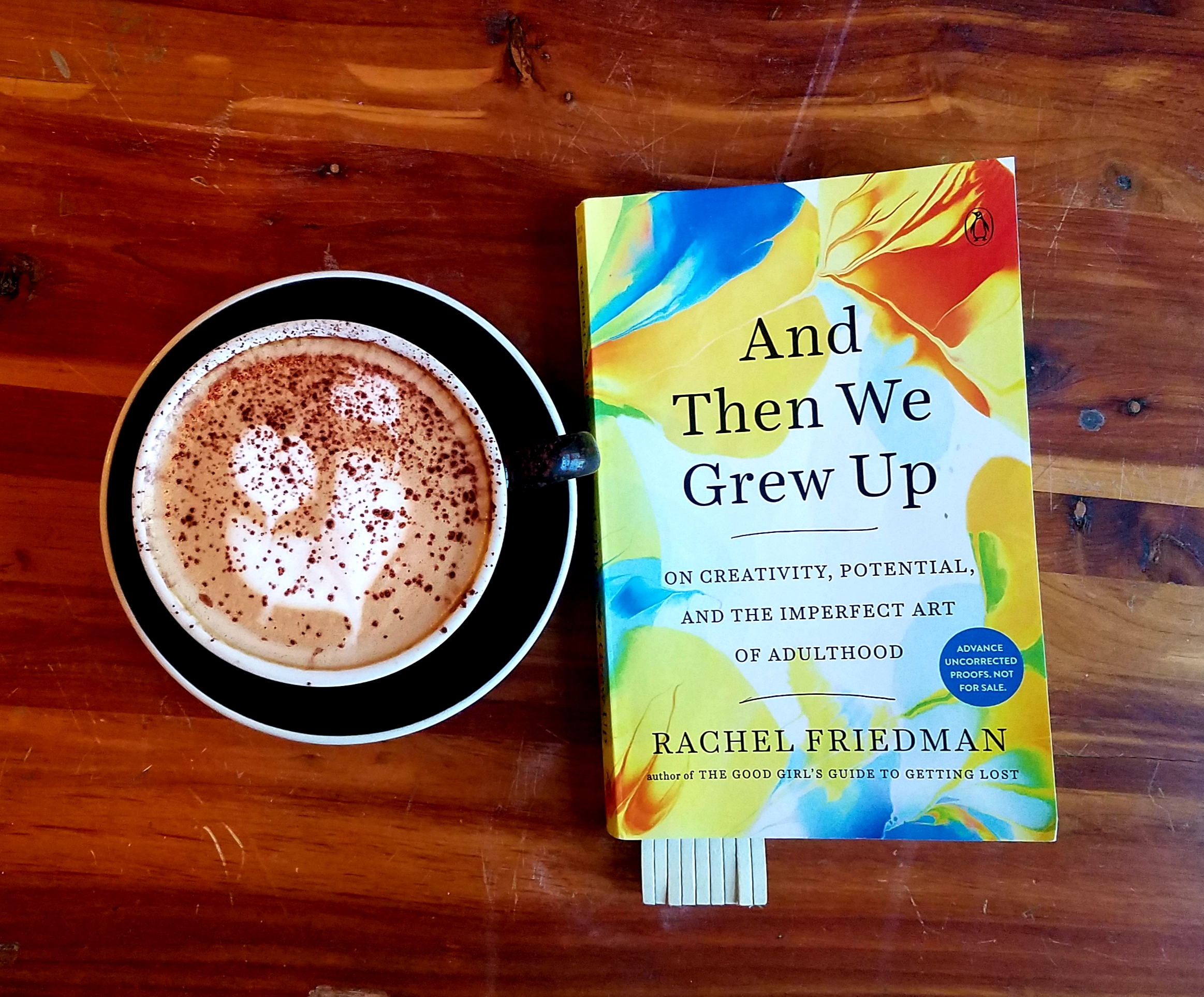 Coffee and book cover of AND THEN WE GREW UP