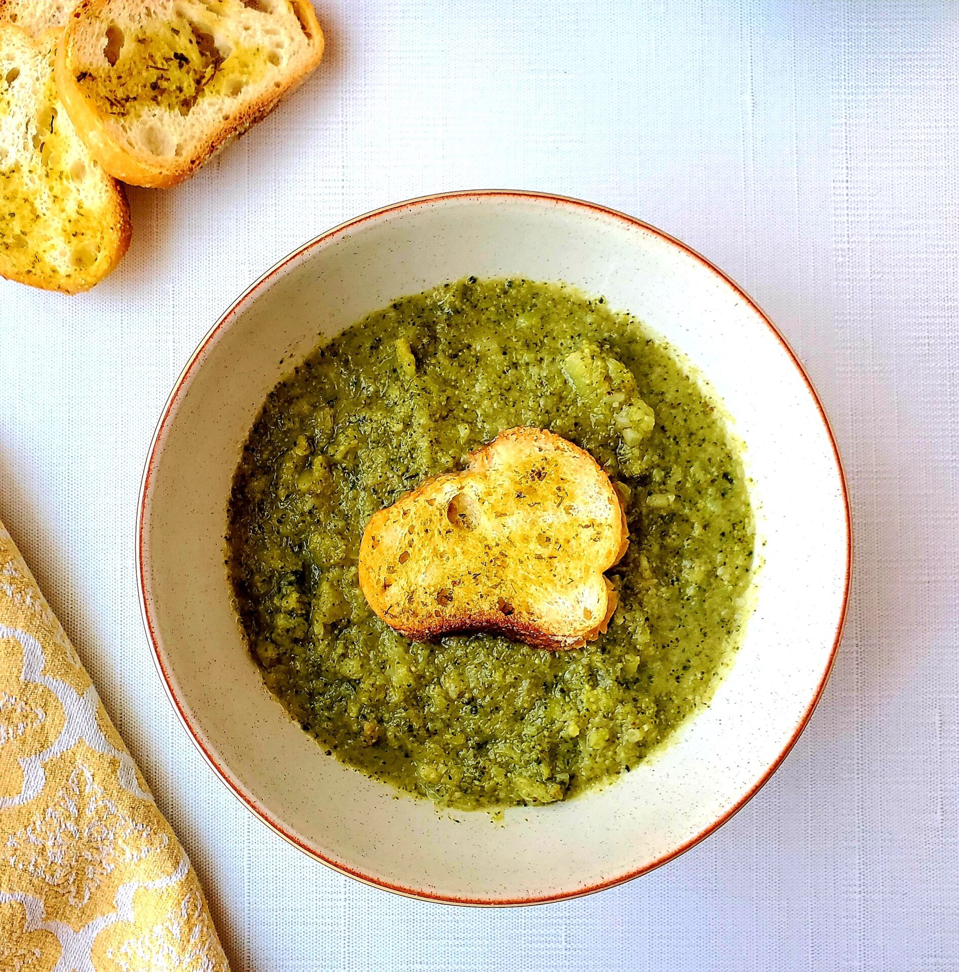 bowl of broccoli soup and crostini