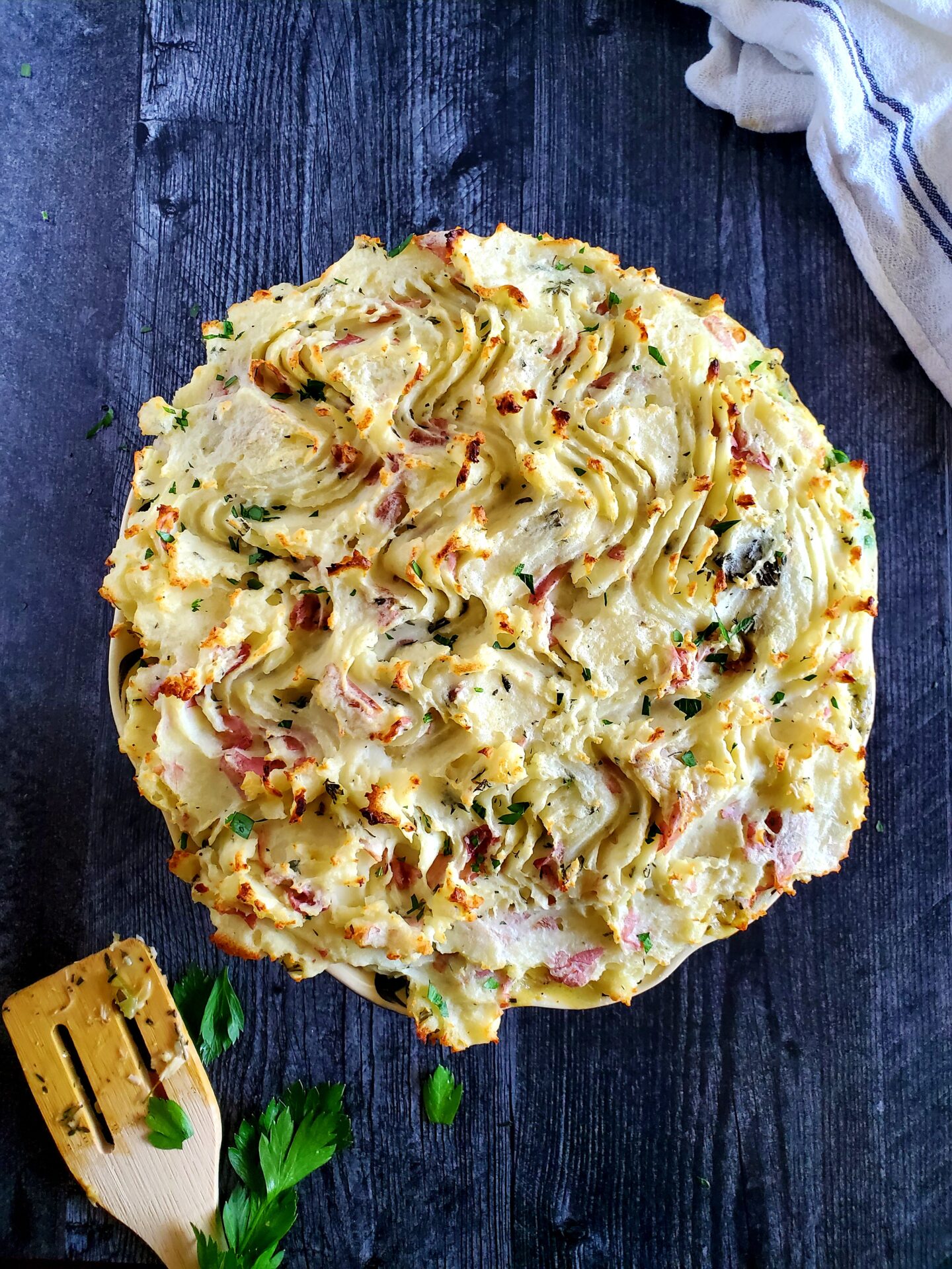 chicken pot pie with mashed potato crust and spatula