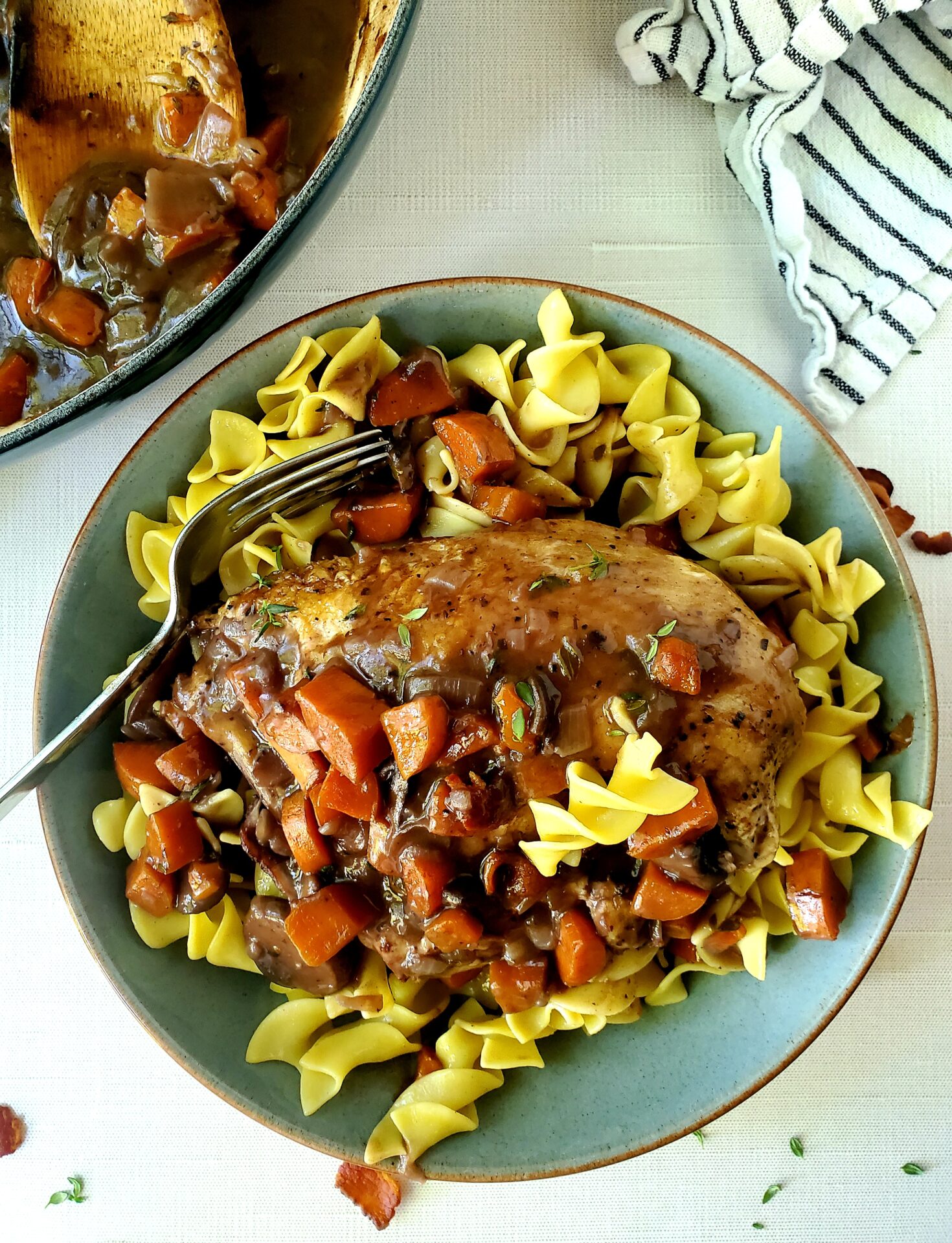 Coq au vin over egg noodles