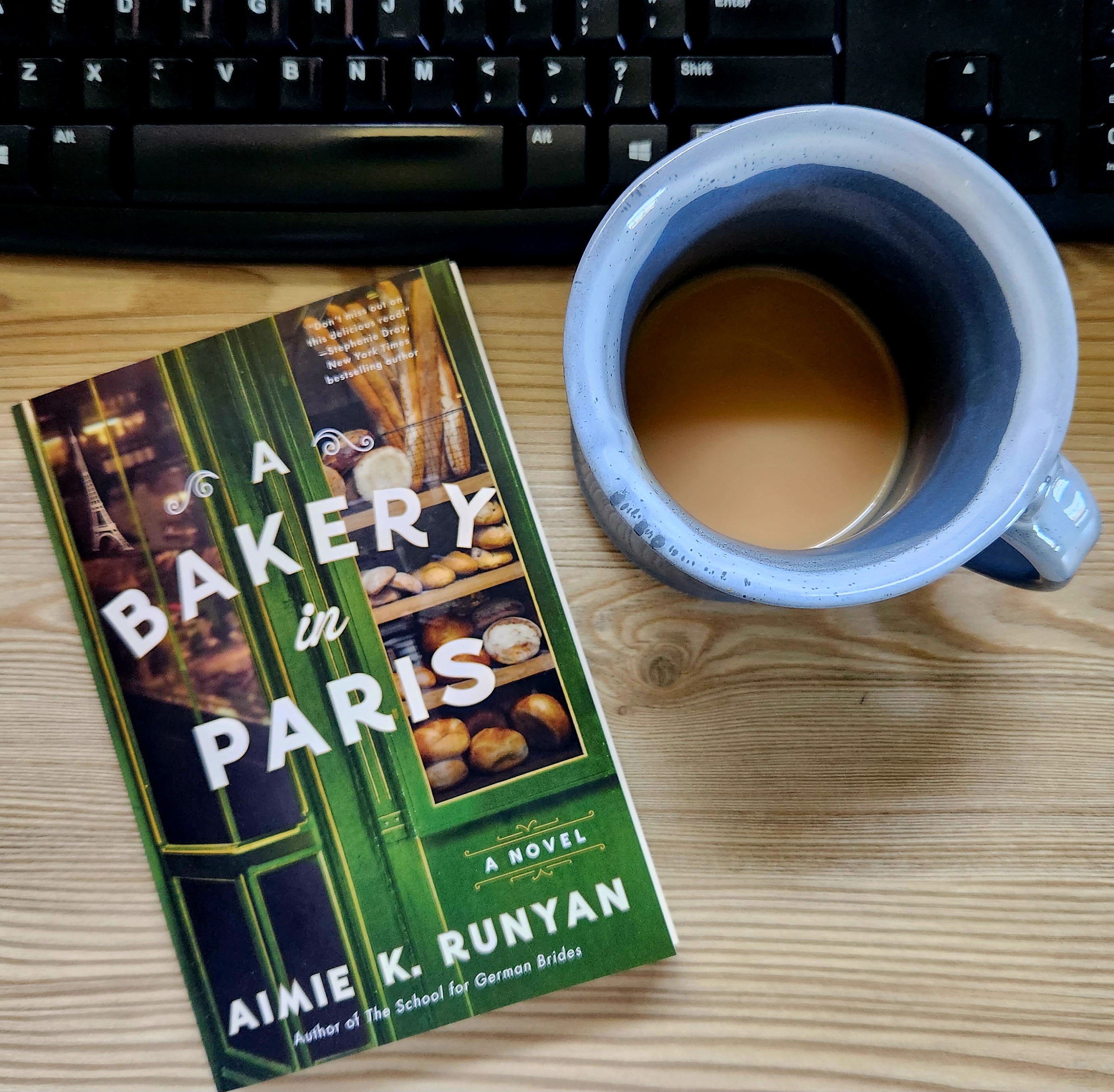 a bakery in paris by aimie k. runyan, book cover and mug of tea