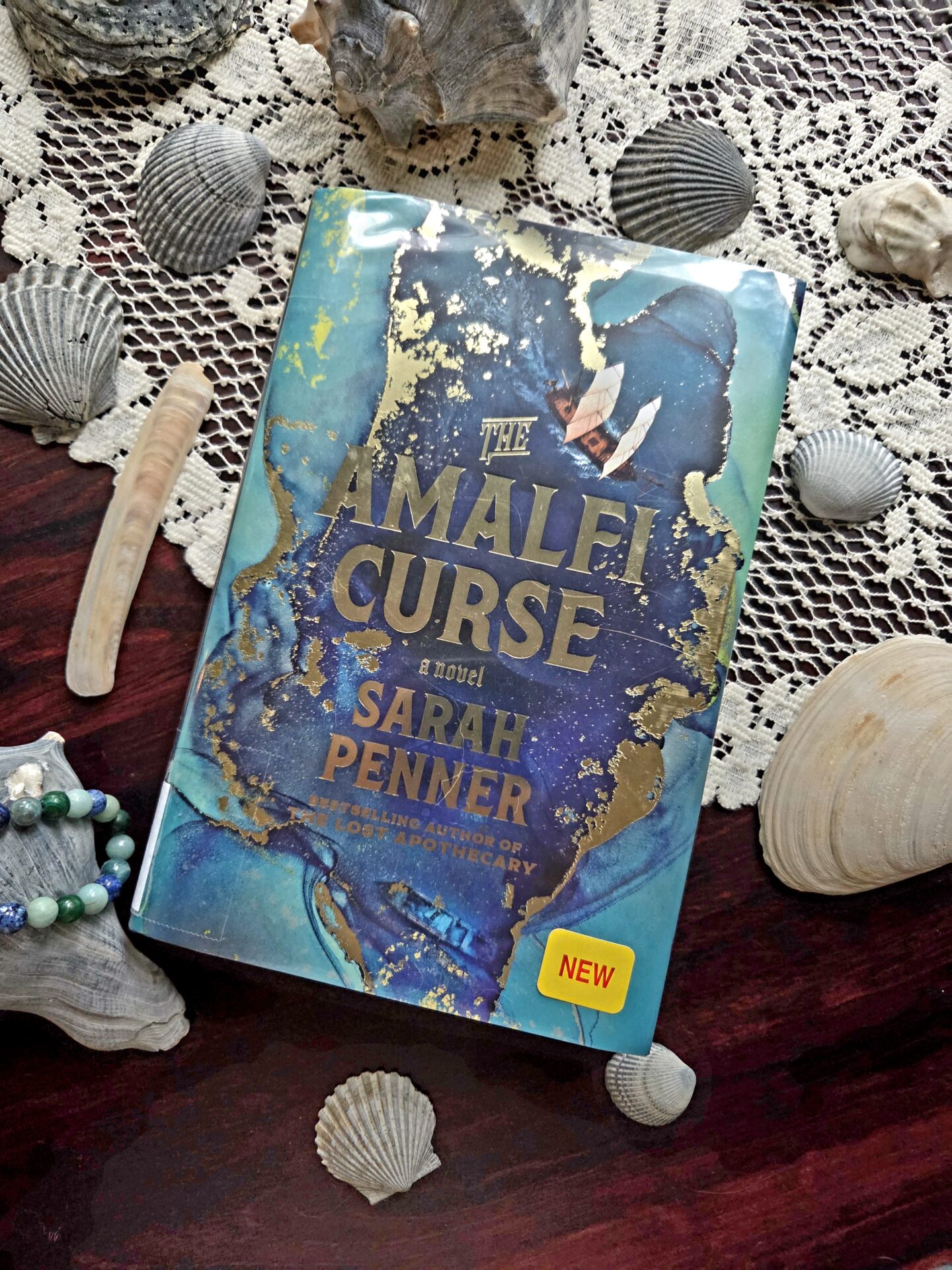 book cover of the amalfi curse by sarah penner