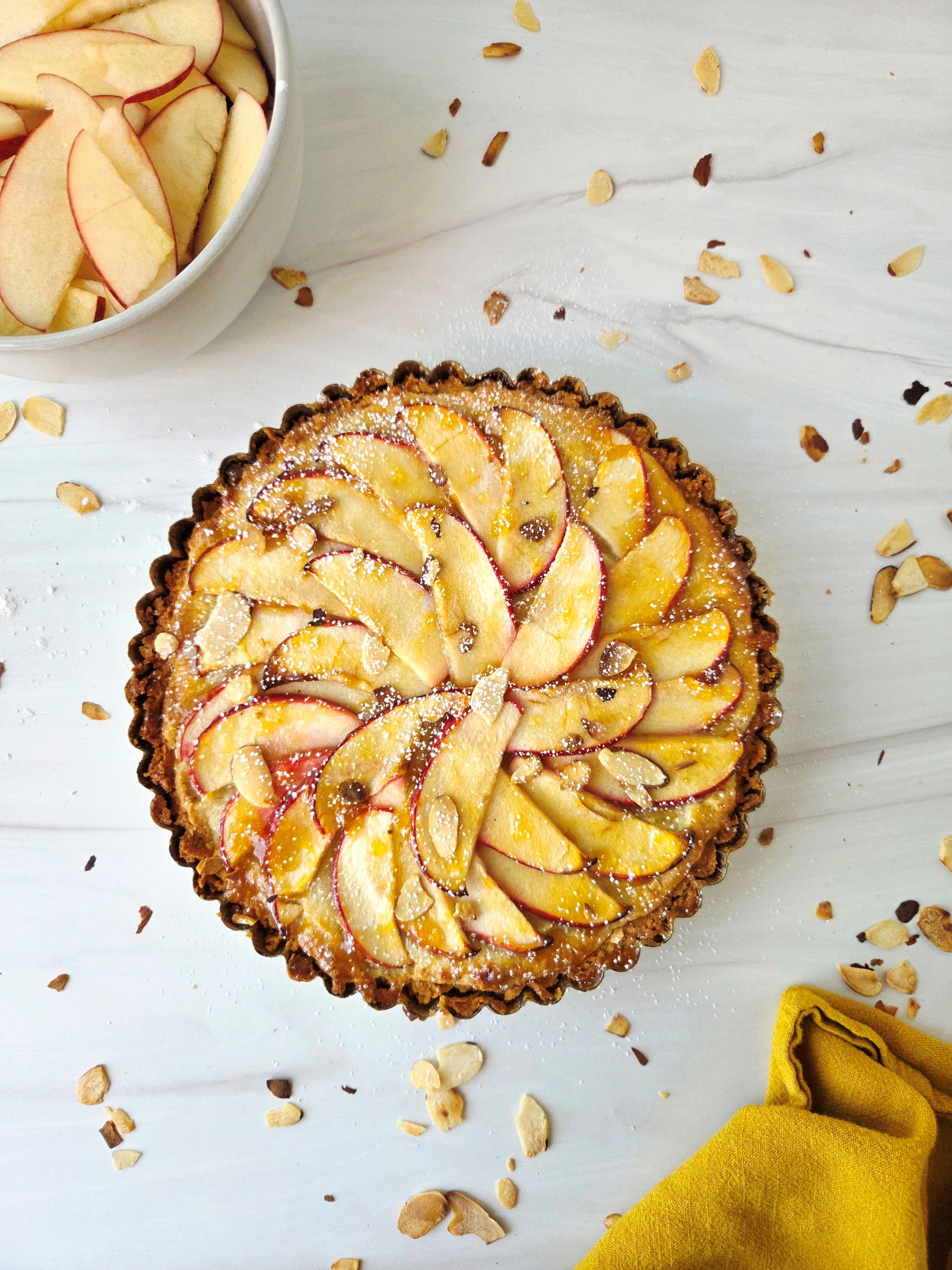 apple almond tart on replica surfaces background